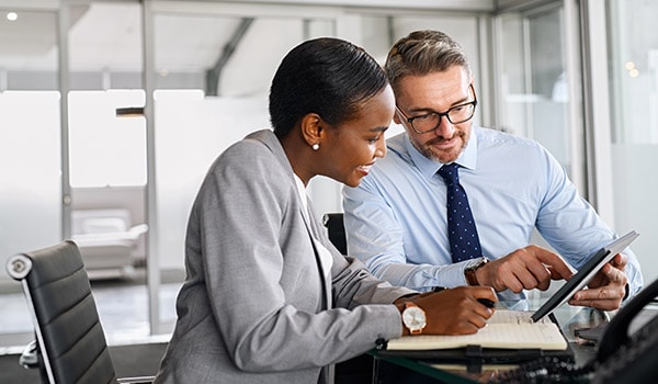 Two professionals collaborating on digital strategy